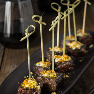 Steak bites with blue cheese butter and smoked pepita crumb - seared to perfection, bursting with flavor, tender steak bites are smeared with melting bluecheese butter, and a crunchy topping of smoked pepitas! | www.viktoriastable.com