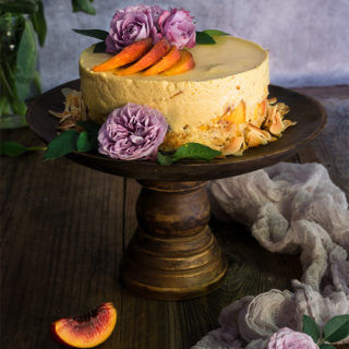 Coconut macaroon peach panna cotta cake - made with coconut cream tangy yogurt, and fresh peaches, this cake is light and fruity, creamy and luxurious - a real summer treat. | www.viktoriastable.com