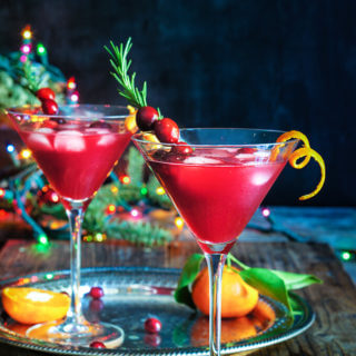 Cranberry rosemary citrus martini - bring on the holiday spirit by shaking up these bright and cheerful, rosemary infused, citrus martinis. | www.viktoriastable.com