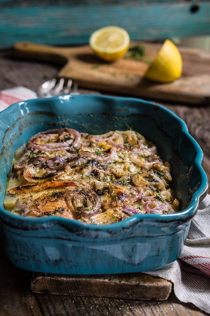 Celery root and smoked salmon gratin - in this creamy dish, aromatic celery root pairs beautifully with smoked fish, red onions and dill-flavored creme fraiche for a quick and easy dinner. | www.viktoriastable.com