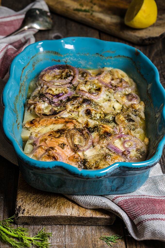 Celery root and smoked salmon gratin - in this creamy dish, aromatic celery root pairs beautifully with smoked fish, red onions and dill-flavored creme fraiche for a quick and easy dinner. | www.viktoriastable.com