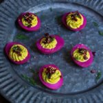 Beet-pickled curry deviled eggs - pickled in beet marinade for a gorgeous magenta color, then stuffed with a delicious curry filling, they make a spectacular appetizer, and a great way to utilize those leftover Easter eggs. | www.viktoriastable.com