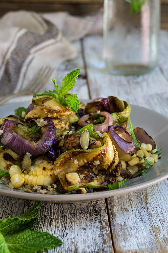 Grilled zucchini and corn quinoa salad - loaded with sweet, grilled summer veggies, healthy quinoa and crunchy toasted pepitas, and bursting with fresh, citrus and mint flavors - so bright, delicious and filling. | www.viktoriastable.com