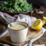 Creamy low fat Caesar salad dressing - healthy Caesar dressing which is packed with protein, low in fat, yet creamy and robust in flavor. | www.viktoriastable.com