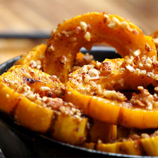 Roasted delicata squash with grilled cheese - almond-crusted delicata squash, roasted in coconut oil, garlic and cinnamon to a golden delicious sweetness, then paired with mild grilled queso panela cheese for the perfect sweet-and-savory balance of flavors. | www.viktoriastable.com