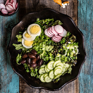 Easter salad - tender lettuce, cucumbers, radishes, green garlic, kalamata olives, boiled eggs - this salad is a celebration of spring at every bite, and a great use of left over Easter eggs. | www.viktoriastable.com