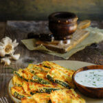 Oven-fried zucchini crisps with garlic yogurt dip - this is a fantastic summer finger food, quick and easy to make, and so delicious you need to triple the recipe! | www.viktoriastable.com