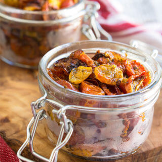 Slow roasted tomatoes - packed with garlic and herb flavors, slightly caramelized and chewy, these tomatoes are so flavorful and versatile, you will want to put them on anything. | www.viktoriastable.com