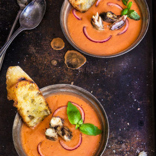 Salmorejo - Spanish creamy tomato and bread soup, served chilled, and topped with smoked sardines, and chopped red onion.| www.viktoriastable.com