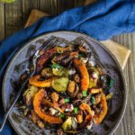 Roasted brussels sprouts and squash salad with horseradish dressing - this warm salad combines all the favorite flavors of fall - the sweetness of roasted veggies and dry fruit, with crunchy nuts, and a pungent horseradish dressing that ties them all in. | www.viktoriastable.com